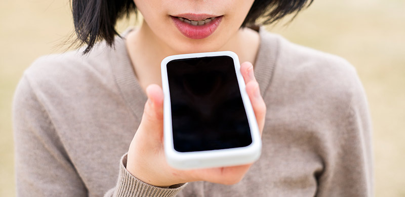women-using-mobile-phone-to-voice-search